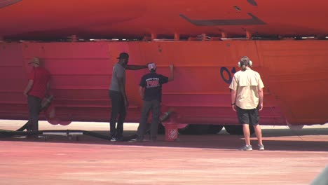 aircraft mechanics working on plane