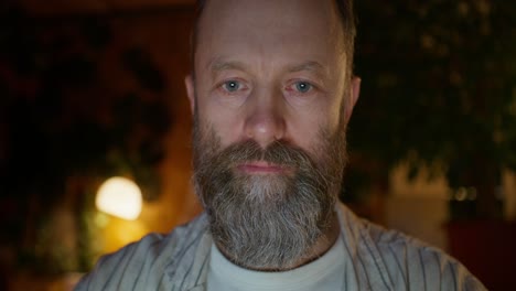 close-up of a man using a smartphone at night