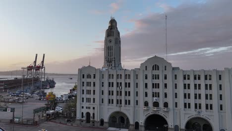 historic building and port in montevideo at sunset