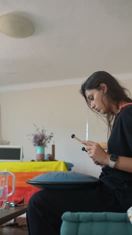 woman playing singing bowl