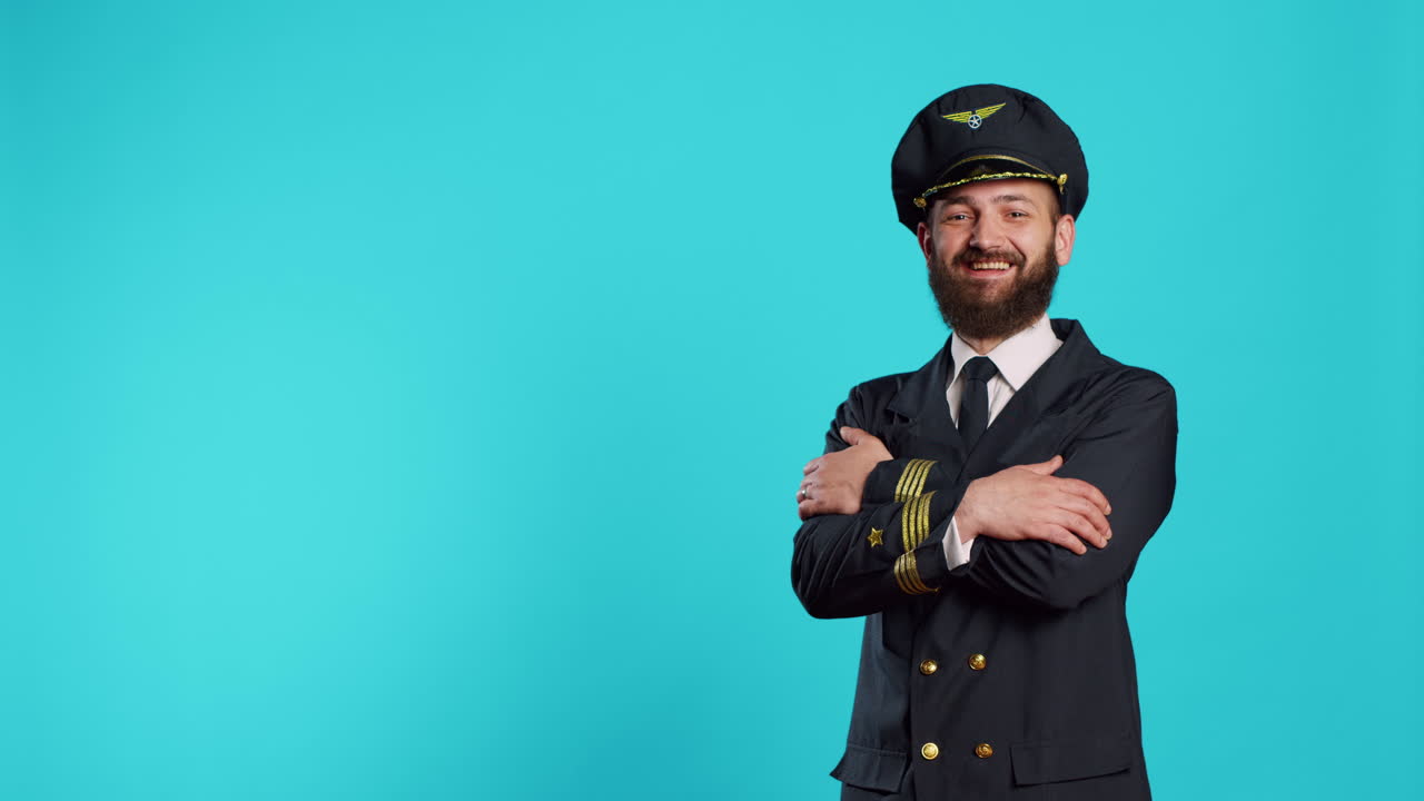 Portrait of smiling aircrew captain posing on camera