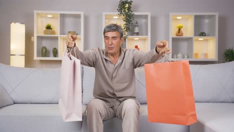 old man looking at camera with shopping bags.