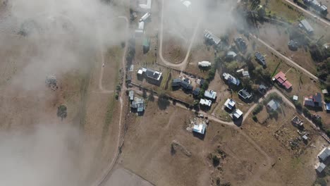 Top-aerial-view-of-houses-in-the-rural-town-of-Tafí-del-Valle-in-the-northern-province-of-Tucumán,-Argentina