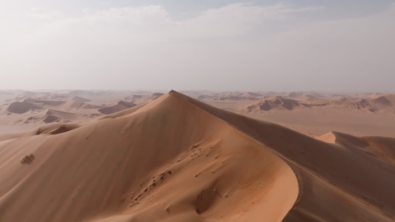 High aerial view of the highest dune in Oman’s Empty Quarter desert during summer