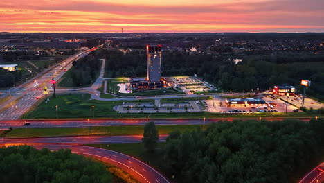 stunning sunset in nl. a vibrant sunset lights up the highway and landscape in the netherlands, highlighting its natural beauty