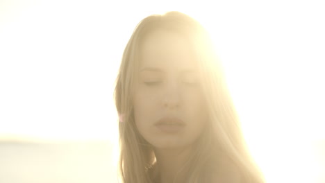 woman at sunrise by the sea