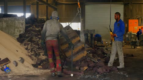 worker operating crane in foundry workshop 4k