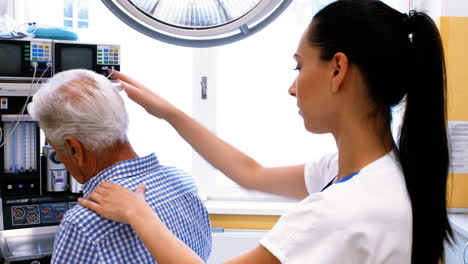 Female-doctor-examining-a-patient