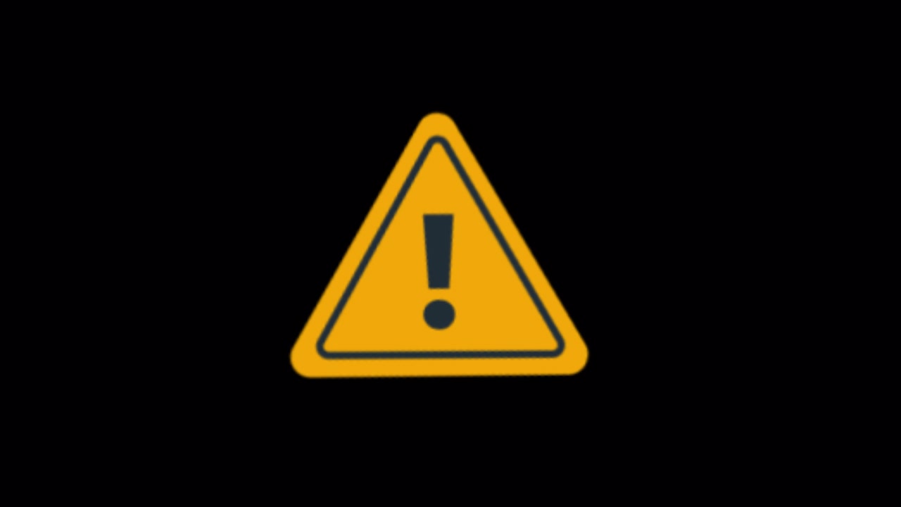 Yellow Warning Triangle Icon With Exclamation Mark on Black Background