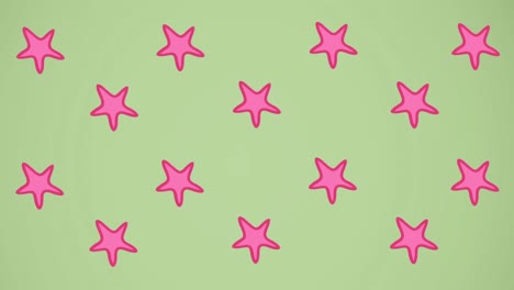 animation of pink starfish spinning on green background