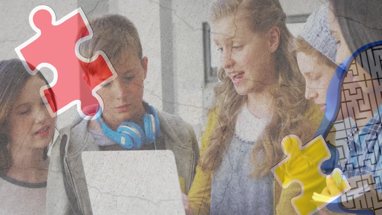 Icona di puzzle e testa umana su un gruppo eterogeneo di studenti che usano un laptop a scuola