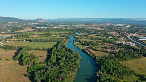 l'argens river with fields around in south of france aerial shot