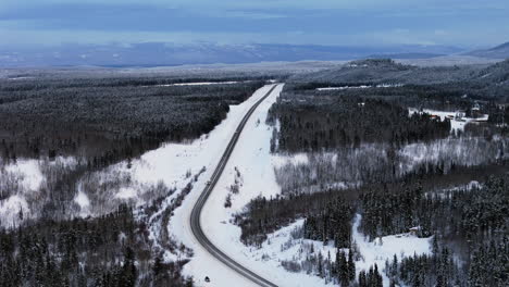 aerial view of alaska highway through the yukon territory in winter.
