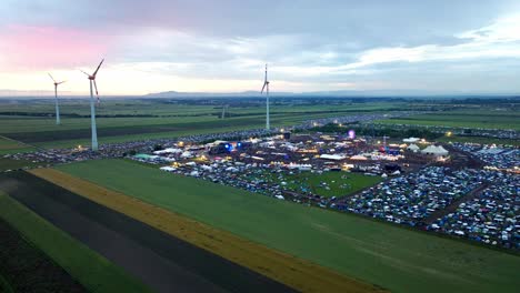 aerial view of music stage and huge crowd during nova rock festival in pannonia fields ii, nickelsdorf, austria - drone shot