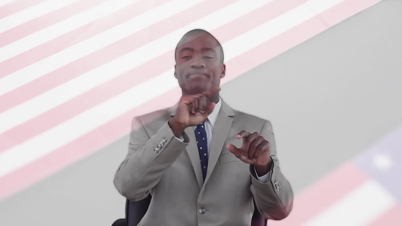 Animation of flag of usa over african american businessman