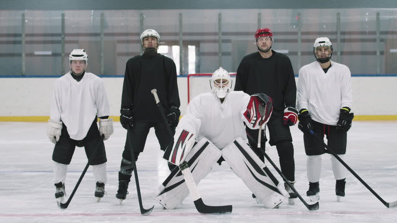 Portrait Of Hockey Players On Ice Rink