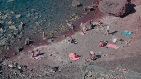 tourist activity on red beach, santorini