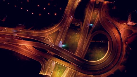 night aerial view of a freeway intersection traffic trails in night moscow