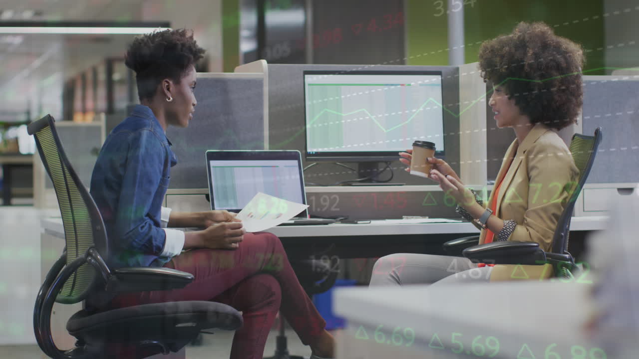 Animation of financial data processing over diverse business people at office