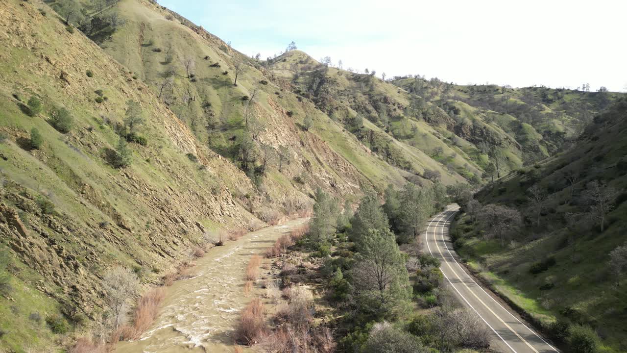 Sunlight glistens on the surface of Cache Creek as it weaves through the Rumsey valley in this aerial footage.