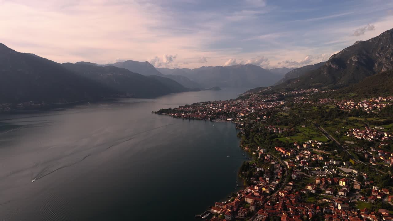 Fly over Abbadia Lariana towards Mandello del Lario at Lake Como, Italy
