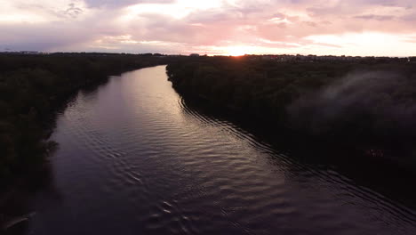 aerial footage of the mississippi river at sunset