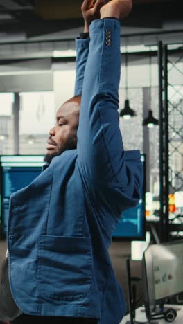 vertical video african american man with a stiff neck and backache stretching his muscles