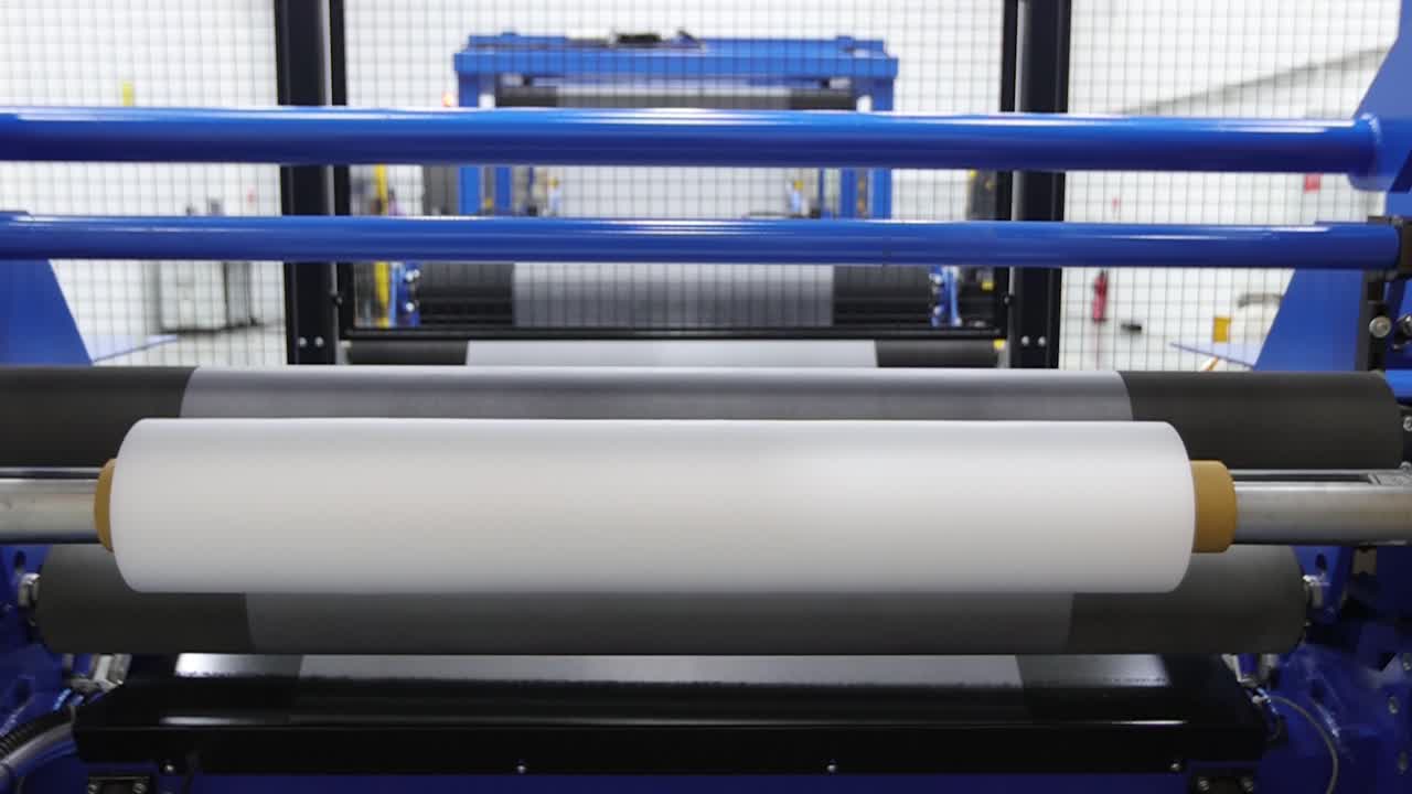 Automatic rewinding machine for EVA plastic film