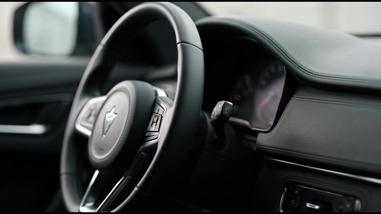 Close-up of Modern Car Steering Wheel and Dashboard Interior