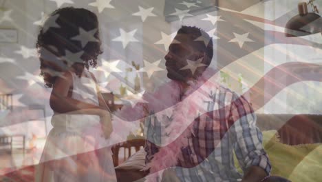 animation of flag of usa over happy african american father with daughter