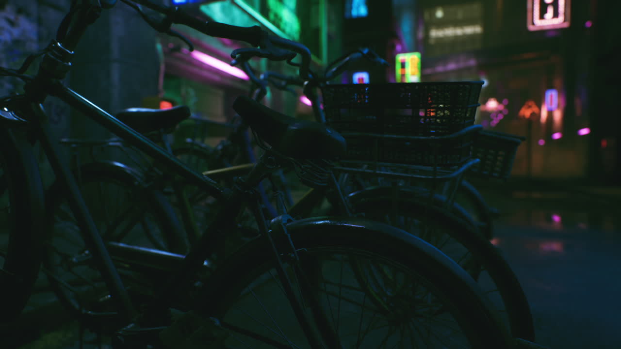 Bikes parked in a neon-lit night city street