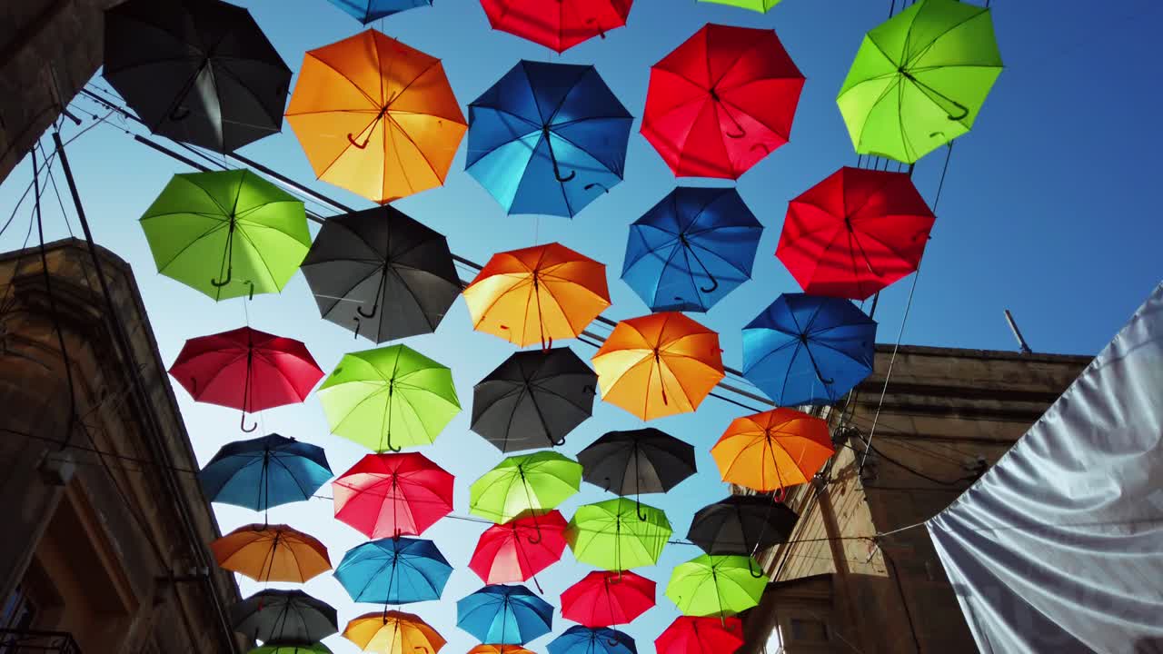 Malta, Zabbar, walking in umbrella street.