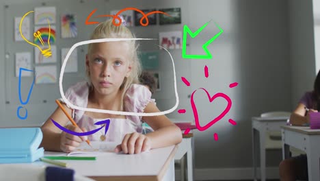 animation of colourful inspiration icons over happy caucasian schoolgirl working at desk in class