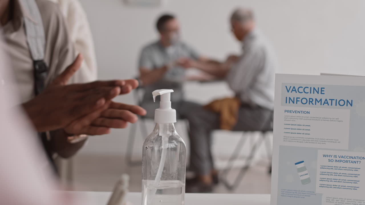 Using Hand Sanitizer in Vaccination Center