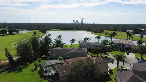 Aerial-video-of-residential-neighborhood-in-shadow-of-coal-burning-power-plant