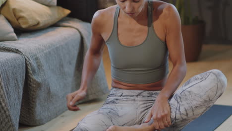 woman doing yoga at home