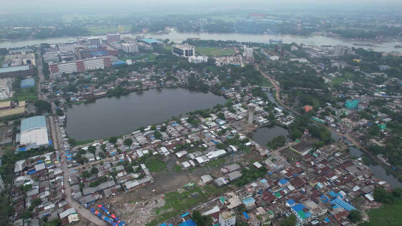 Riverside Slum Area with Pond