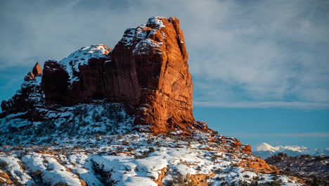 timelapse, arches national park utah usa in winter season, snow capped red rock formations and sky