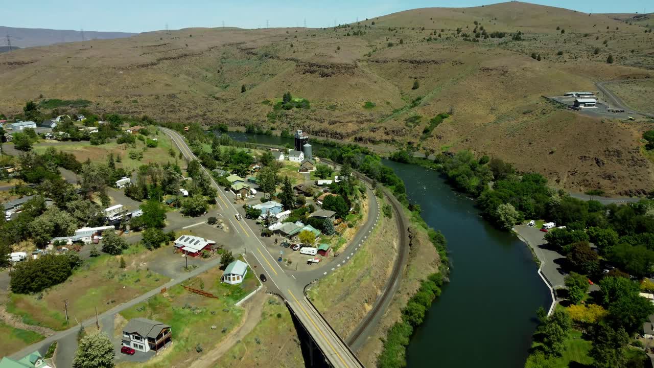 US, Oregon, Maupin, , 2025-05-08 - Drone view of the railroad, grain elevator, and the Deschutes River at the city of Maupin in north central Oregon