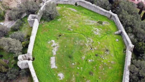 stunning aerial view flight bird's eye view drone footage of castle ruins of a byzantine fortress of 13th century wild nature corfu greece