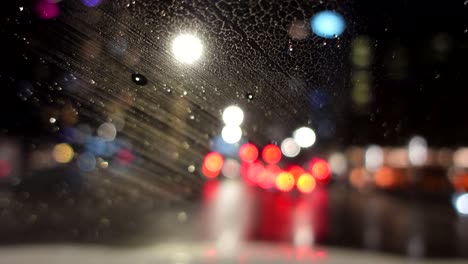 Out-of-focus-footage-of-driving-at-a-rainy-night