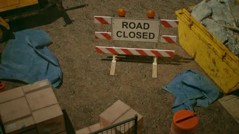 Construction-site-elements-with-road-closed-sign-and-dust-particles,-3D-animation,-animated-scene,-camera-zoom-in