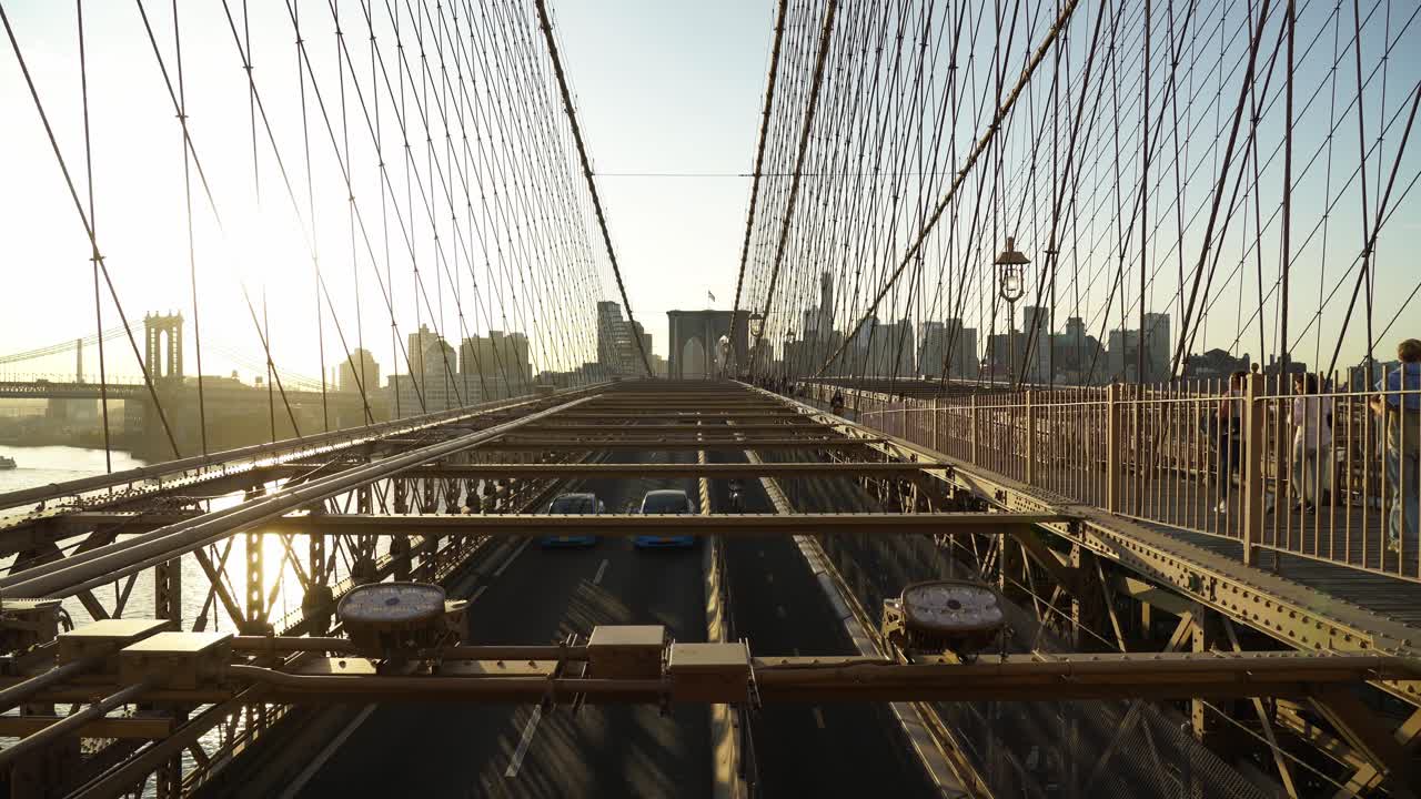 Busy Cars Traffic through Brooklyn Bridge to Lower Manhattan