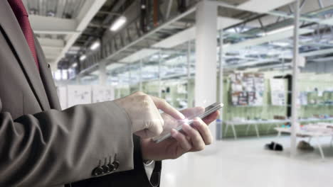 businessman using smartphone in office