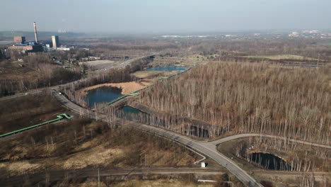 Aerial-view-of-the-lake-landscape-around-a-coal-mine-in-Karviná,-Czech-Republic