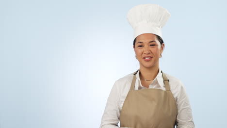 Happy-asian-woman,-chef-and-pointing