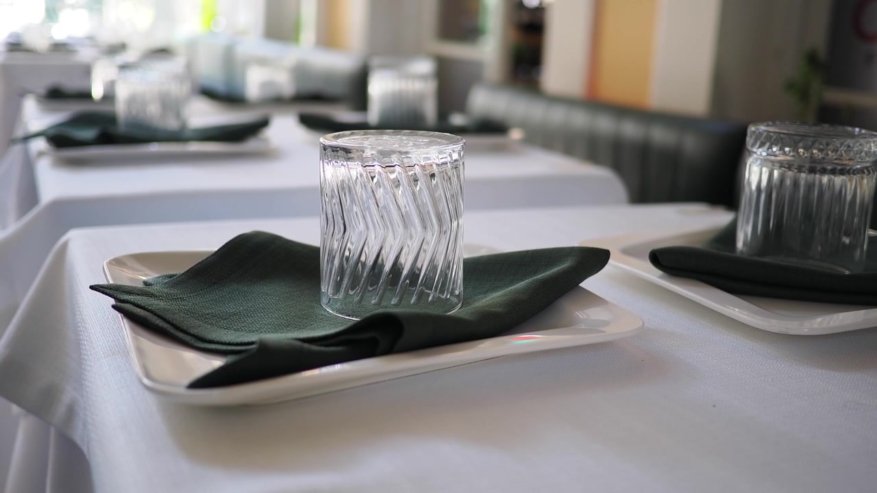 Empty Restaurant Tables Set for Dining
