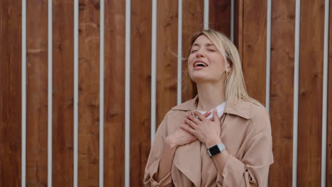 woman laughing outdoors