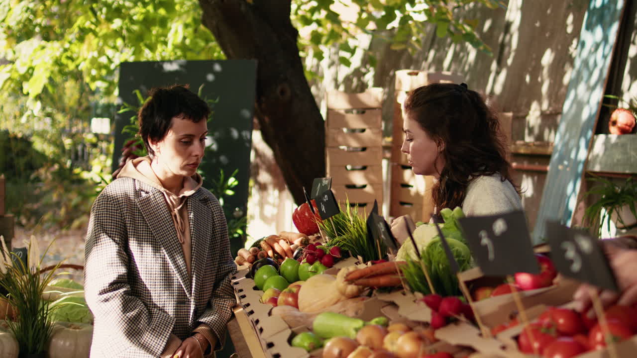People buying fresh produce at a farmers market