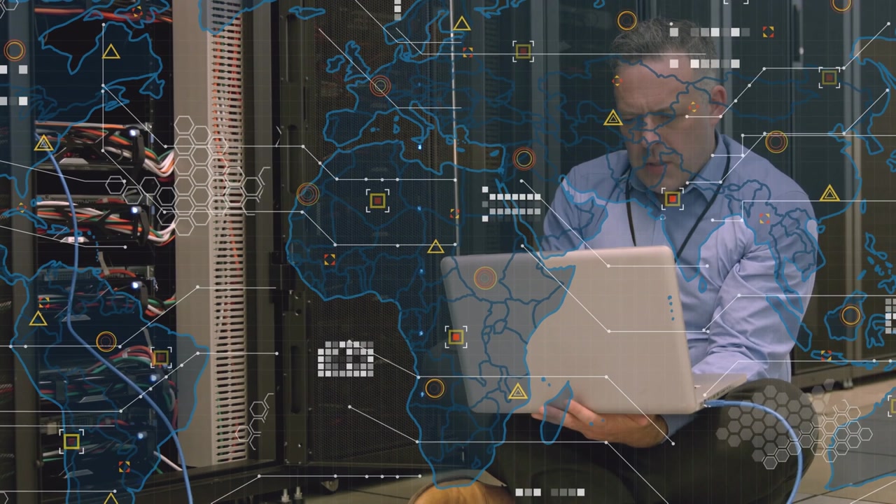 Animation of world map over caucasian businessman in server room